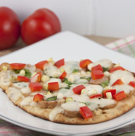 Naan Flatbread Pizza Recipe with fresh mozzarella, red pepper, and chicken sausage.
