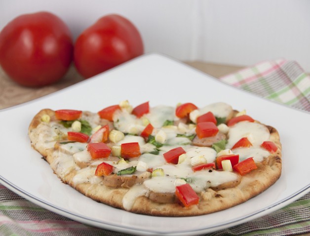 Naan Flatbread Pizza Recipe with fresh mozzarella, red pepper, and chicken sausage.