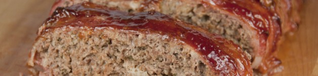 The best meatloaf recipe where the meatloaf is wrapped in bacon and brushed with barbeque sauce