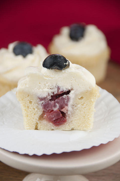 Strawberry Filled Patriotic Cupcakes on a cupcake stand.