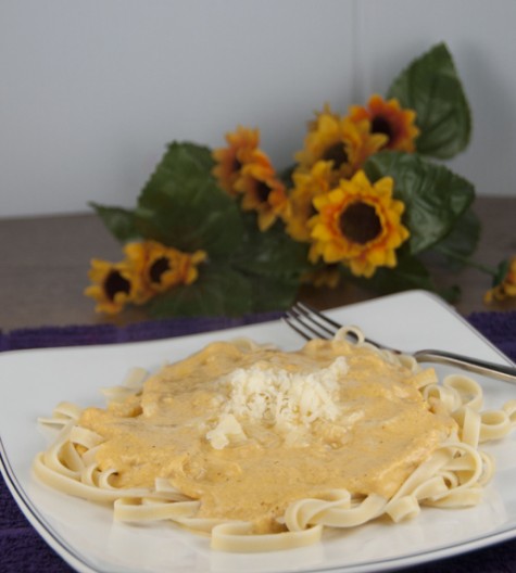 Homemade Cheesy and Creamy Pumpkin Alfredo Sauce served over pasta makes the perfect fall dish your whole family will love.