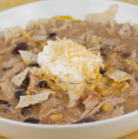 This no-fuss Chicken Tortilla Soup is quick to make, incredibly flavorful, and filling and garnished with crushed corn tortilla chips!