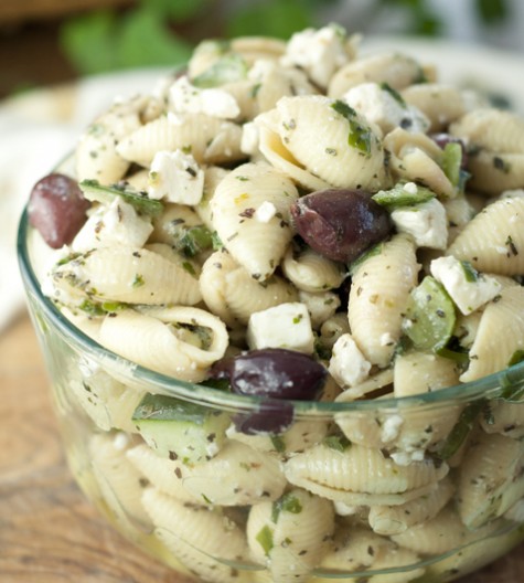 This side dish recipe for Greek Pasta Salad has all of the refreshing flavors of a classic Greek salad with cucumber, olives, and feta cheese. Everyone at your picnic will love this!