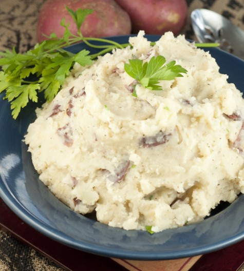 A hands-off recipe for herb Slow Cooker Buttery Garlic Mashed Potatoes making for an easy, stress-free side dish for Thanksgiving and all of the holidays.