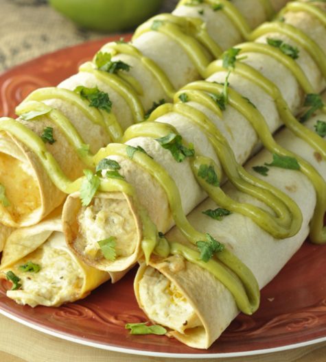 I'm so excited to share this quick and easy Crock Pot Creamy Salsa Verde Chicken Taquitos recipe that is perfect for a main course or appetizer and drizzled with my favorite avocado spread.