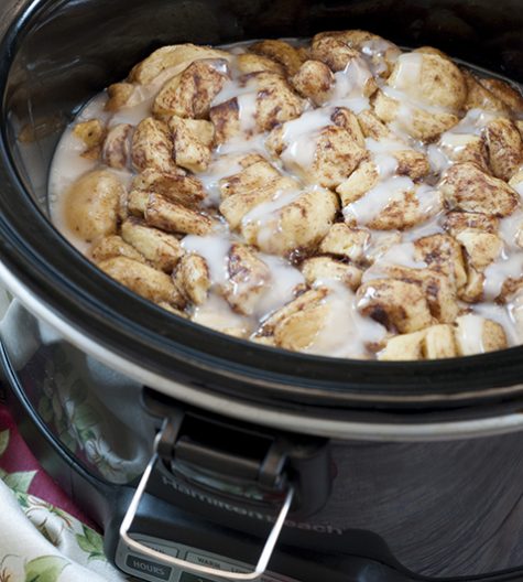 Easy, delicious, Gooey Crock Pot Cinnamon Roll Casserole recipe is sure to be a favorite for breakfast, the holidays or when you want breakfast for dinner! Your family will devour this!