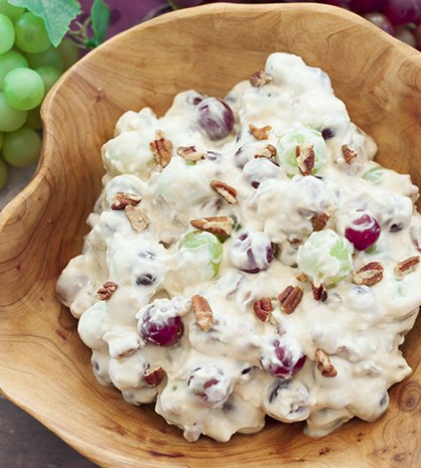 You're just 7 ingredients away from this Creamy Pecan Crunch Grape Salad recipe. It is guaranteed to be a huge hit at office potlucks, BBQ's, holiday dinners and parties!