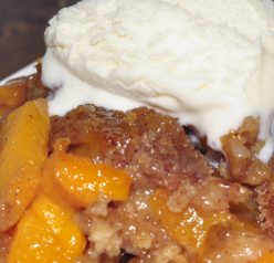 Crock Pot or Slow Cooker Peach Cobbler dessert recipe is best served warm and topped with vanilla ice cream. It's an easy dessert to throw in the crock pot and just let it cook. Everyone loves this!