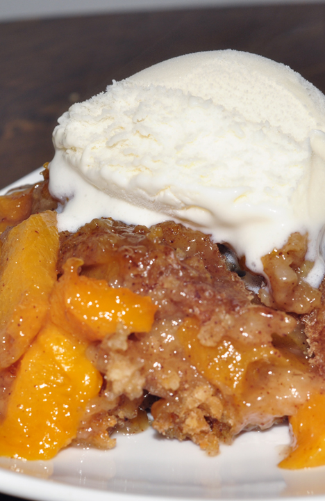 Crock Pot or Slow Cooker Peach Cobbler dessert recipe is best served warm and topped with vanilla ice cream. It's an easy dessert to throw in the crock pot and just let it cook. Everyone loves this!