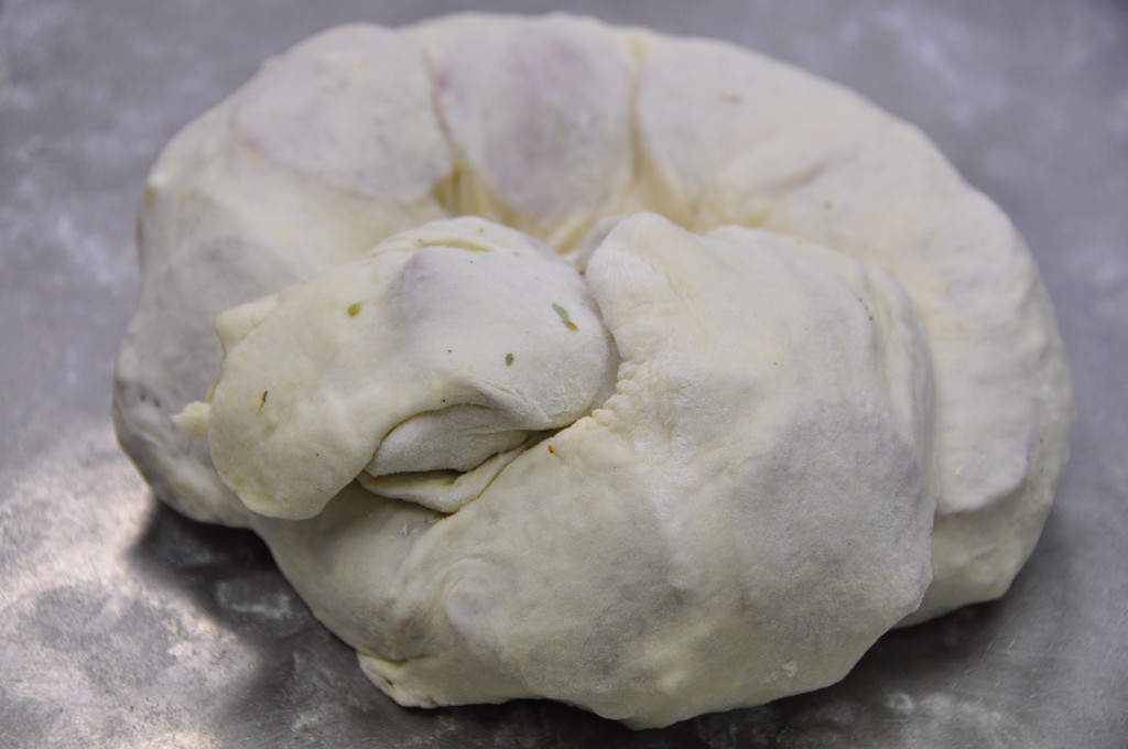 The steps in rolling the pizza dough for the Pepperoni Pizza Bread Recipe.