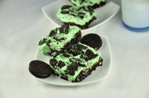 Sinful Triple Layer Fudge Mint Oreo Brownies are rich and loaded with chocolate goodness. Everyone will go crazy over this dessert recipe and it's festive and fun!