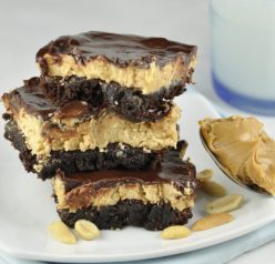 This recipe for Buckeye Brownies is the most amazing brownie you will ever taste: loaded with peanut butter, gooey chocolate, and layers of deliciousness.