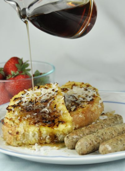 Coconut Crusted French Toast with strawberries and chicken breakfast sausage