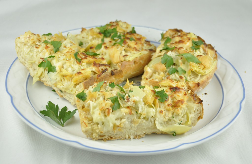 Cheesy Artichoke French Bread Pizza with Panko bread crumbs.  Perfect party appetizer!