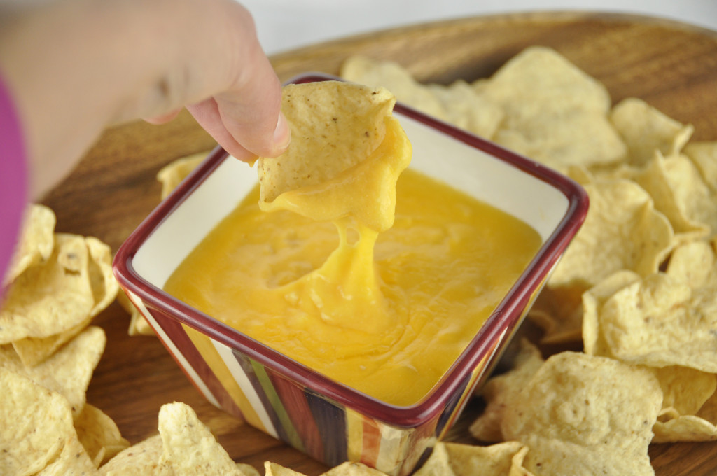Beer Cheese Fondue Dip is an easy appetizer recipe containing melted cheese combined with a subtle taste of beer to make the perfect holiday appetizer, Super Bowl snack, or game day appetizer dip!