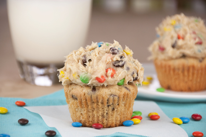Monster Cookie Dough Cupcakes. Peanut butter cupcakes with monster cookie dough frosting