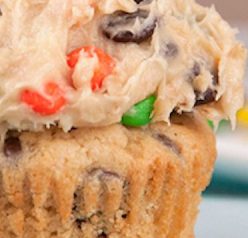 Rich peanut butter cupcakes are topped with a sweet and loaded cookie dough frosting packed full with peanut butter, chocolate chips and M&M candy! This is the best cupcake recipe ever!