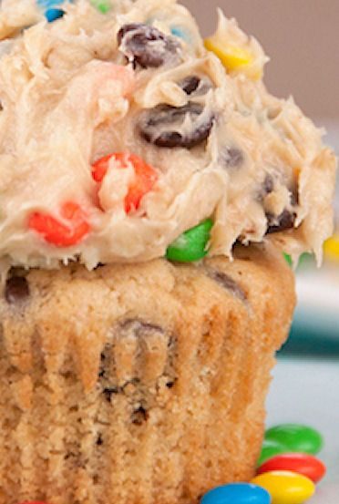 Rich peanut butter cupcakes are topped with a sweet and loaded cookie dough frosting packed full with peanut butter, chocolate chips and M&M candy! This is the best cupcake recipe ever!