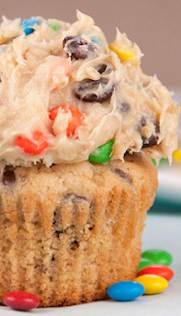 Monster Cookie Dough Cupcakes are rich peanut butter cupcakes topped with a sweet and loaded cookie dough frosting packed full with peanut butter, chocolate chips and M&M candy! This is the best cupcake recipe ever!