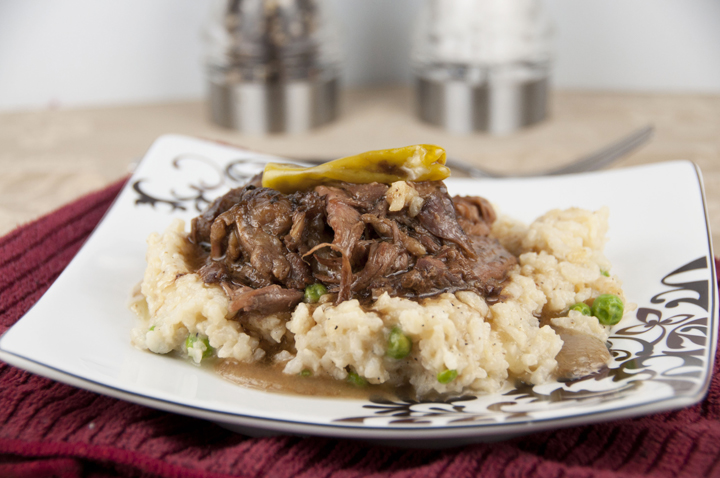 Slow Cooker Mississippi Pot Roast recipe is a comforting, tasty meal made right in your crock pot.  The meat drippings produce their own gravy and the roast is so tender that it just falls apart!