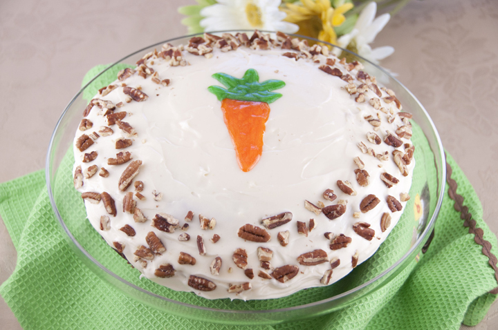 A super  rich, simple, one layer moist carrot cake recipe made from scratch with chopped pecans and topped with cream cheese frosting. This is great for Easter or to celebrate your favorite carrot cake loving person in your life!