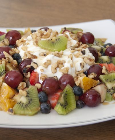 Fruit and Nut Salad made with fresh fruits, walnuts, and raw honey. Perfect breakfast, healthy dessert, or snack.