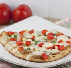 Naan Flatbread Pizza Recipe with fresh mozzarella, red pepper, and chicken sausage.