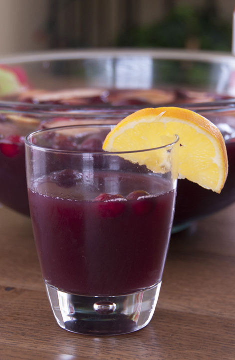 Cranberry Pomegranate sangria with orange, apples, and lemons makes a festive drink recipe to toast the winter holidays or Christmas party!