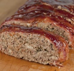 The best meatloaf recipe where the meatloaf is wrapped in bacon and brushed with barbeque sauce