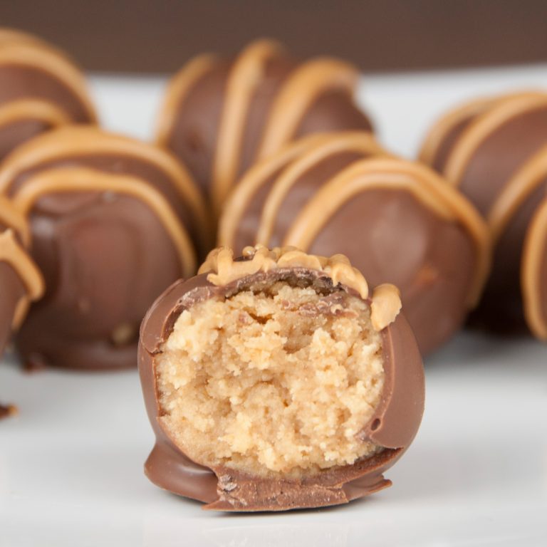 Nutter Butter Truffles recipe are perfect for any holiday or event! Peanut butter cookies covered in chocolate and drizzled with melted peanut butter.