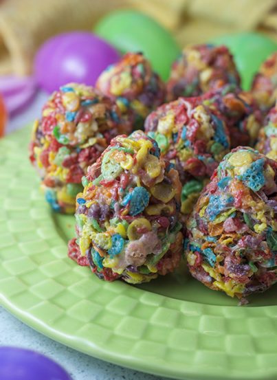 Easy Fruity Pebble Easter egg dessert treats are made with three simple ingredients: kids' cereal, marshmallows and butter. Shape them into Easter eggs to make a fun, easy, no-bake treat for the holiday!