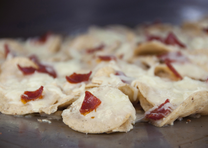 Pepperoni pizza nachos make a great cheesy snack or appetizer for any party.