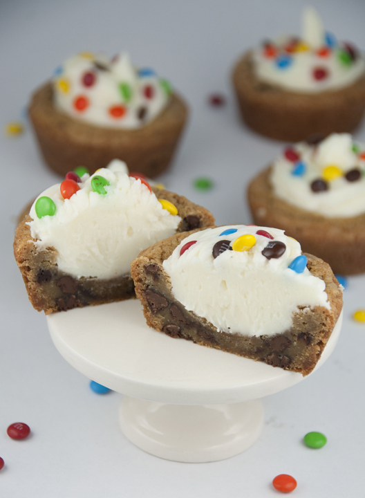 Giant Chocolate Chip Cookie Cups recipe with Almond Buttercream Icing topped with mini M&M's for a fun splash of color make for the perfect dessert for any occasion