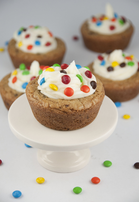 Giant Chocolate Chip Cookie Cups recipe with Almond Buttercream Icing topped with mini M&M's for a fun splash of color make for the perfect dessert for any occasion