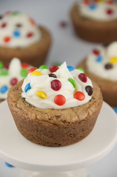 Giant Chocolate Chip Cookie Cups recipe with Almond Buttercream Icing topped with mini M&M's for a fun splash of color make for the perfect dessert for any occasion.