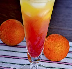Tequila Sunrise alcoholic drink: grenadine, orange juice, and tequila. Great for Cinco de Mayo or a hot summer day!