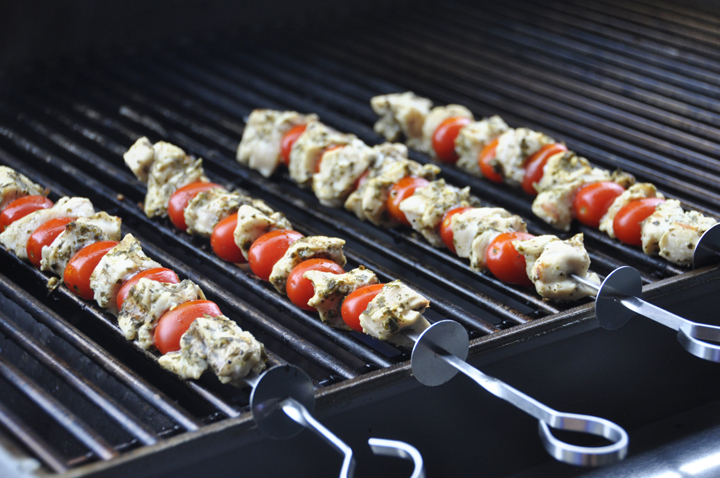 Super easy, healthy restaurant-quality Grilled Pesto Chicken and Tomato Kabobs recipe for summer grilling and entertaining!