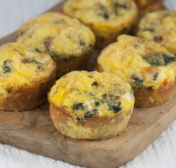 A recipe for Scrambled Egg Breakfast Muffins with sausage and green peppers or spinach that are pretty, hearty and fun to serve for breakfast or brunch.