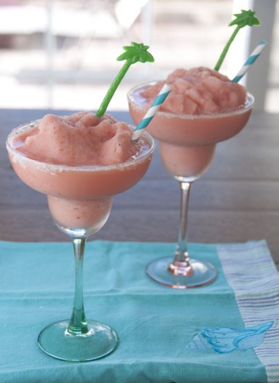 This frozen strawberry daiquiri recipe makes for a refreshing cocktail after a long, hot summer day. It is made with frozen fruit bars and I even included a kid-friendly version!