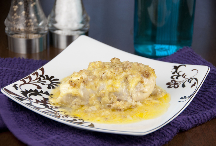 Chicken recipe in white wine cream soup is coated with the smooth, slightly sweet tang of melted Swiss cheese and topped with buttered stuffing.