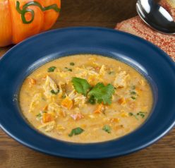 This easy pumpkin soup is made with chicken, pumpkin puree, chicken stock, and fresh vegetables Cream and cheese are stirred in at the end for added richness. The perfect fall soup!