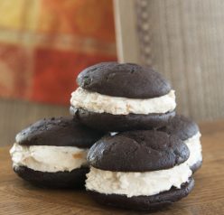 Two saucer-shaped rounds of soft chocolate cake sandwiched around a sweet orange marmalade marshmallow cream filling for a classic whoopie pie.