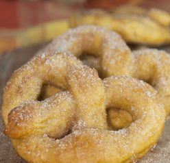 Soft, delicious pumpkin pretzels coated in cinnamon sugar made from scratch and perfect for fall! Pumpkin season isn’t complete without these.