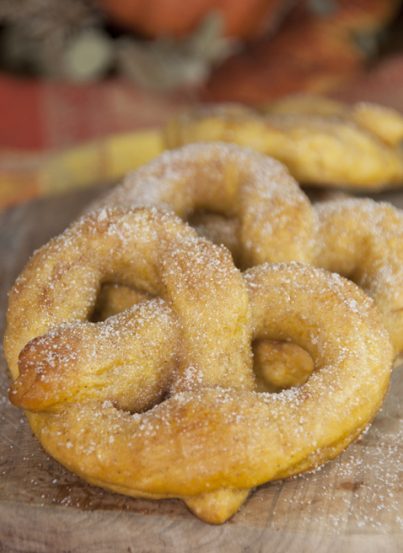 Soft, delicious pumpkin pretzels coated in cinnamon sugar made from scratch and perfect for fall! Pumpkin season isn’t complete without these.