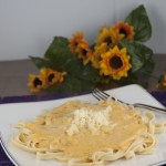 Homemade Cheesy and Creamy Pumpkin Alfredo Sauce served over pasta makes the perfect fall dish your whole family will love.