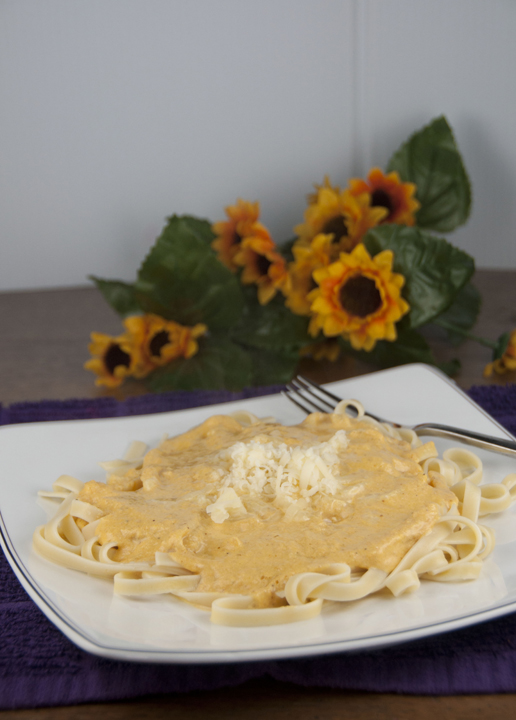 Homemade Cheesy and Creamy Pumpkin Alfredo Sauce served over pasta makes the perfect fall dish your whole family will love.