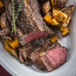 Make this year's holiday feast an effortlessly elegant event with this tender, juicy strip roast recipe rubbed with garlic and fresh thyme.