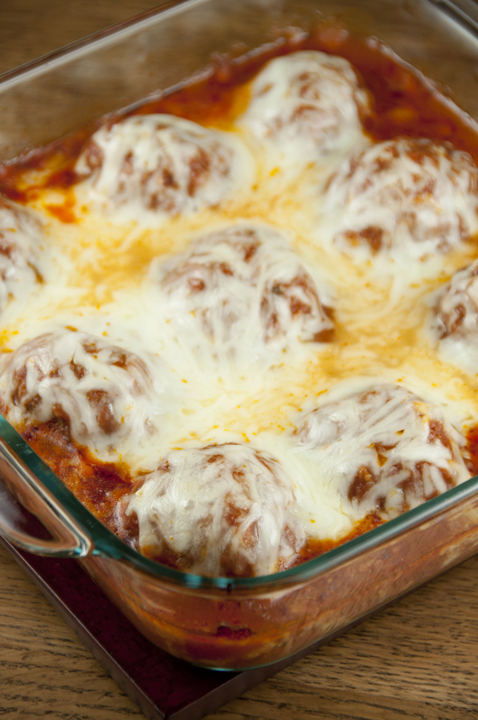 Meatball Parmesan is cheesy meatballs with tomato sauce baked right in the oven - no mess or frying! Good enough for a fancy dinner to serve for a holiday or to dinner guests.