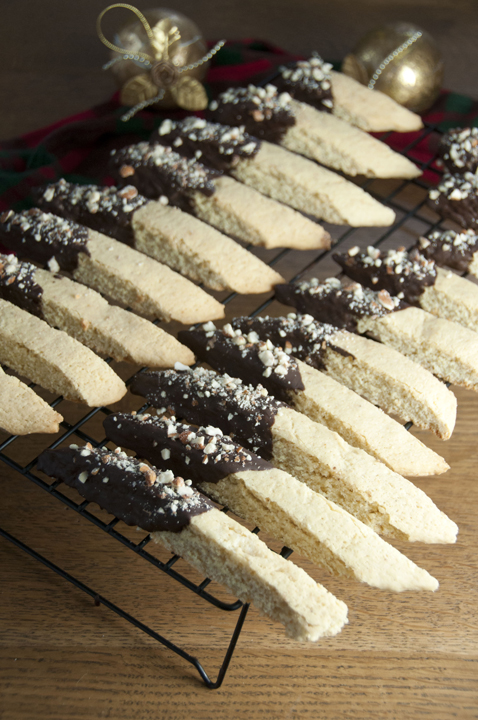 Orange Chocolate Almond Biscotti are Italian cookies paired with orange zest, toasted almonds and melted semi-sweet chocolate. Perfect for a cookie exchange or Christmas.