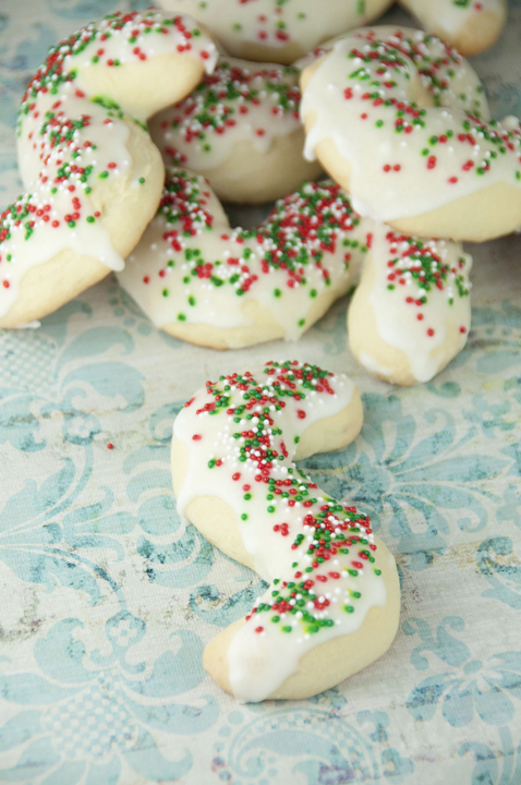 Grandma's recipe for Italian "S" cookies. These have white icing and Christmas sprinkles on them and will be a great addition to your holiday cookie trays.